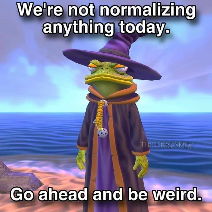 A green cartoon frog wearing a purple wizard hat and robe stands on a beach with ocean in the background. The text overlaid…