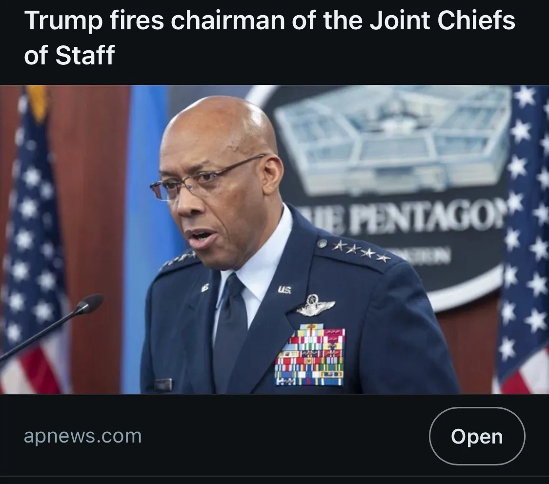 A photo shows a Black man in a U.S. Air Force general's uniform with four stars, speaking at a podium in front of a Pentagon…