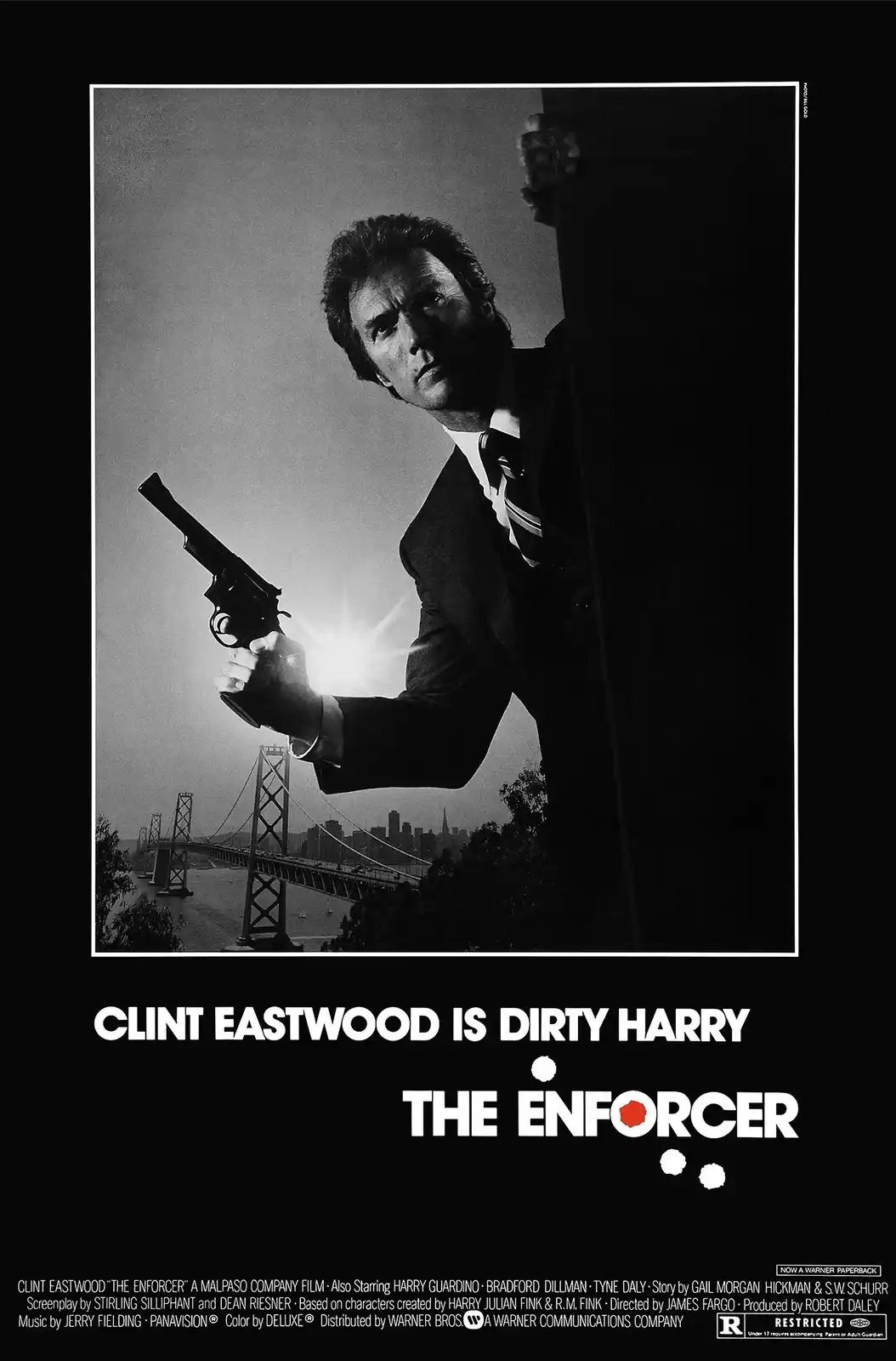 A black-and-white movie poster for 'The Enforcer' shows Clint Eastwood in a suit holding a revolver, peeking from behind a…