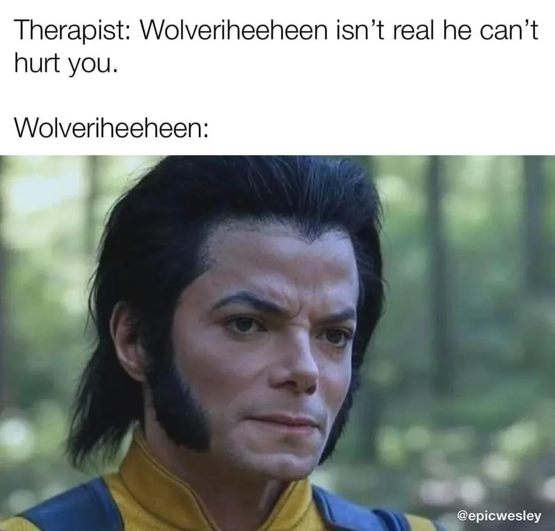 The image shows a close-up of Michael Jackson dressed as Wolverine from X-Men, with a serious, skeptical expression. The…