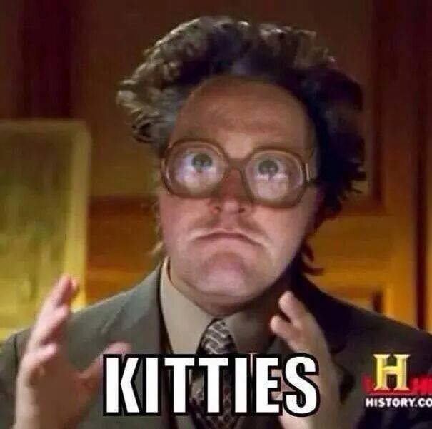 A man with wild hair and thick glasses stares with wide eyes and a confused expression, hands raised slightly. The word…