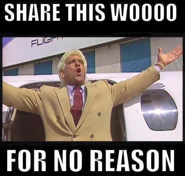 A man with blonde hair, wearing a tan suit and red tie, stands with arms outstretched in front of a white airplane, mouth…