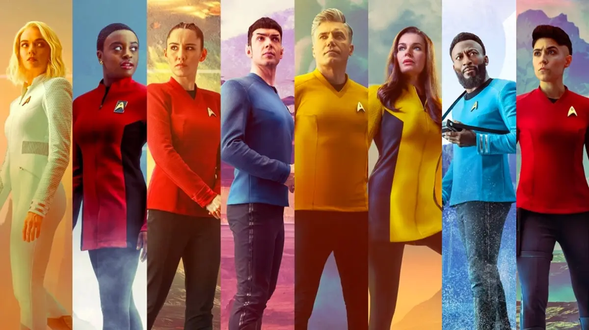 The image displays eight characters from the Star Trek series, each in a different colored uniform (white, red, blue…