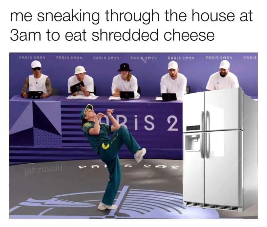A woman in a green tracksuit performs a dramatic, athletic leap toward a white refrigerator, set against a backdrop of a…