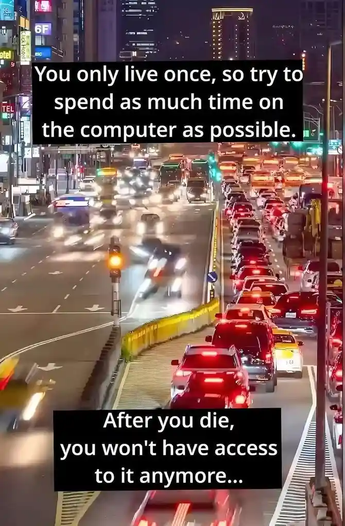 A nighttime city street view shows heavy traffic with cars and motorcycles moving slowly or stopped in lanes, illuminated by…