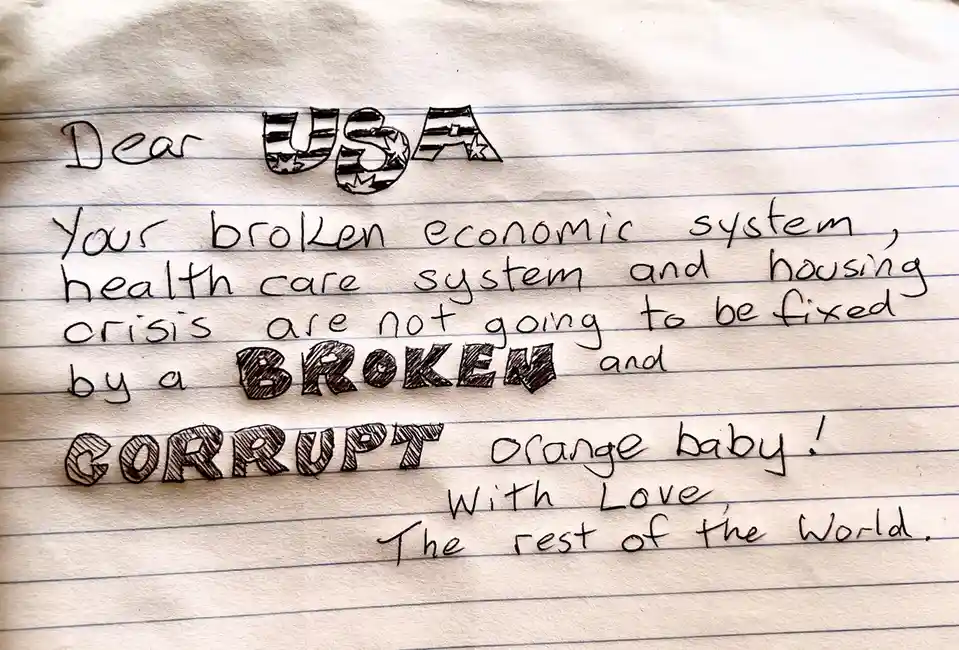 A handwritten letter on lined paper addressed to 'USA', with the word 'USA' drawn as a flag. The letter criticizes the U.S…