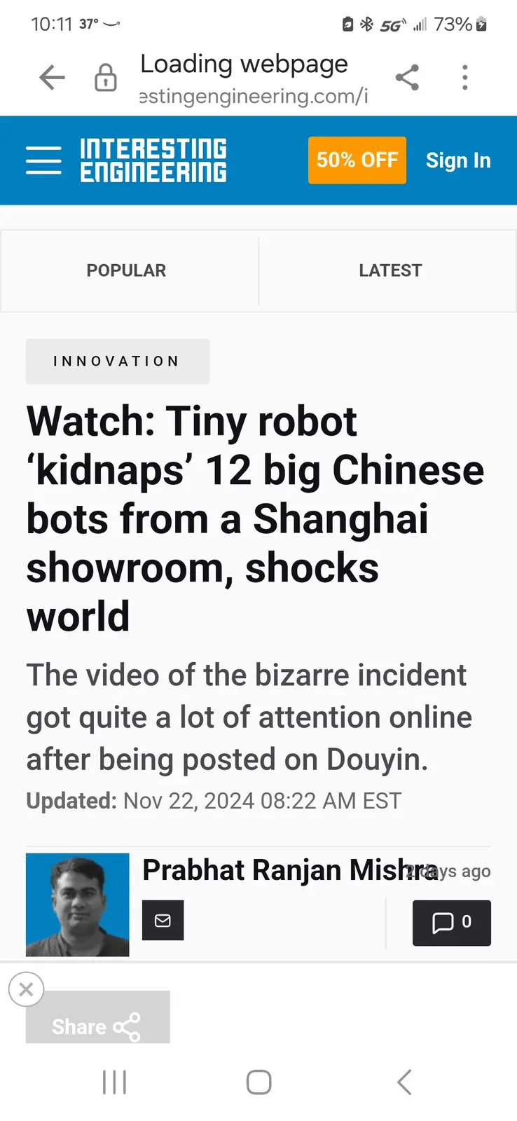 A smartphone screenshot shows a webpage from 'Interesting Engineering' with a headline about a tiny robot 'kidnapping' 12…