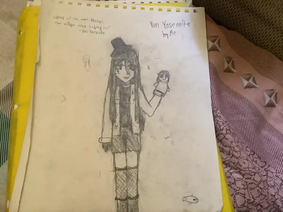 A hand-drawn pencil sketch on lined paper shows a tall anime-style girl with long hair, a top hat, and a scarf, holding a…
