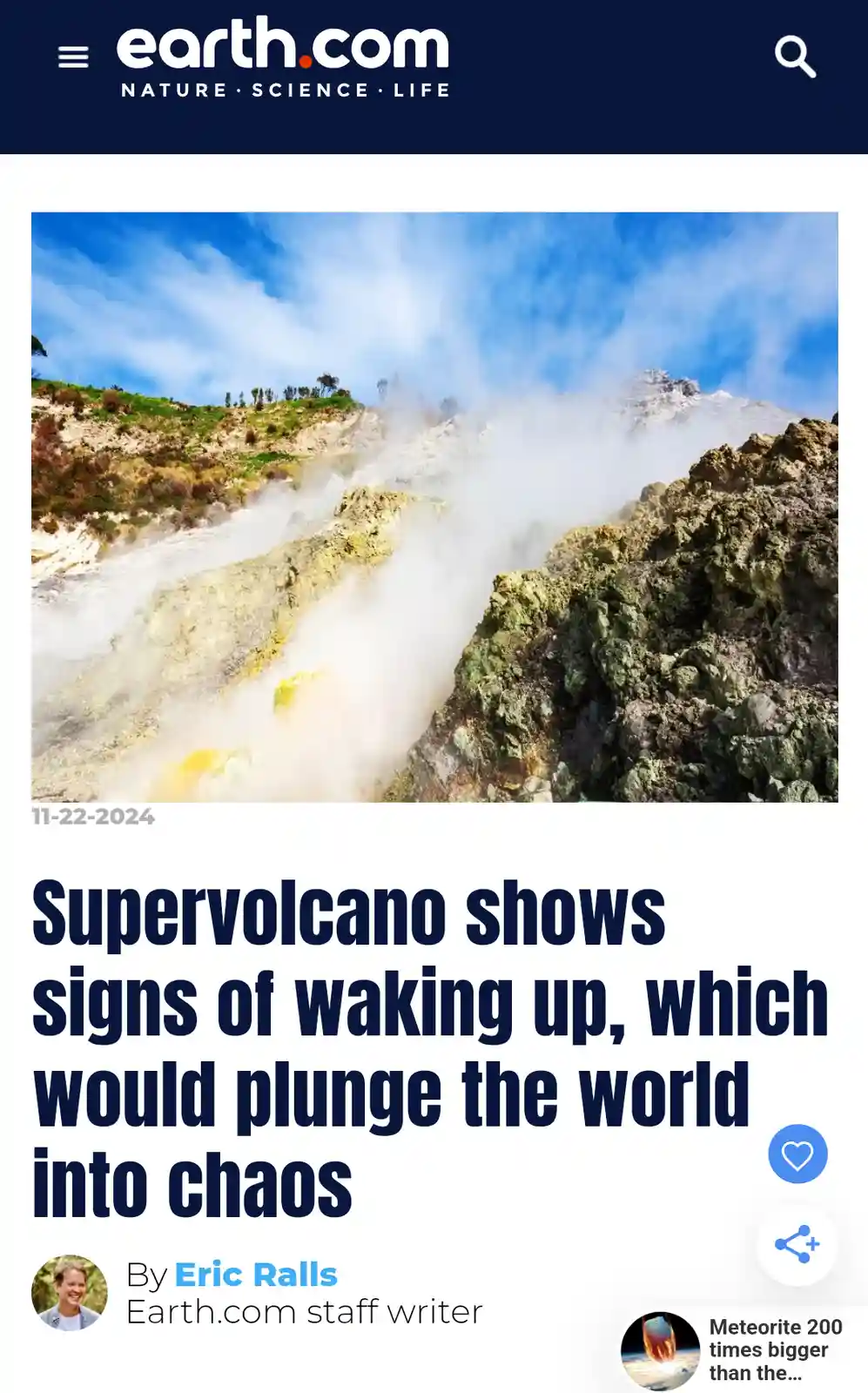An image of a steaming, geothermally active volcanic landscape with rocky terrain and billowing white steam under a blue…