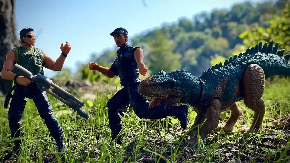 Two action figure soldiers stand in a grassy outdoor setting, one holding a rifle while the other runs away from a large…