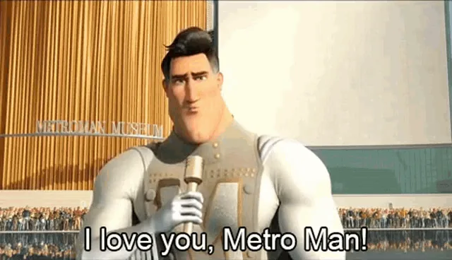 The image shows Metro Man from the movie 'Incredibles 2' giving a speech at the Metro Man Museum. He starts by saying 'I…