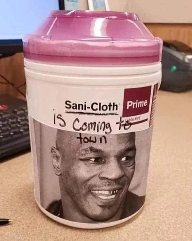 A pink-lidded container of Sani-Cloth Prime disinfecting wipes has a black-and-white photo of Mike Tyson on its label…