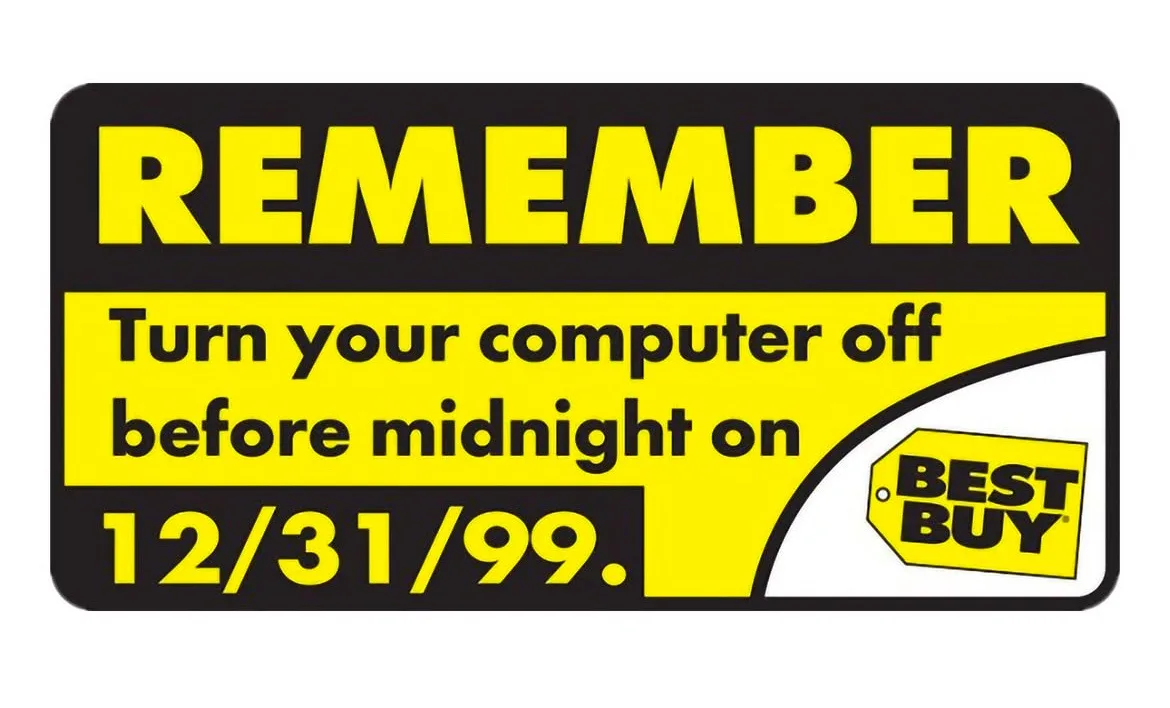 A Best Buy promotional sign with bold yellow text on a black background instructs users to 'REMEMBER Turn your computer off…