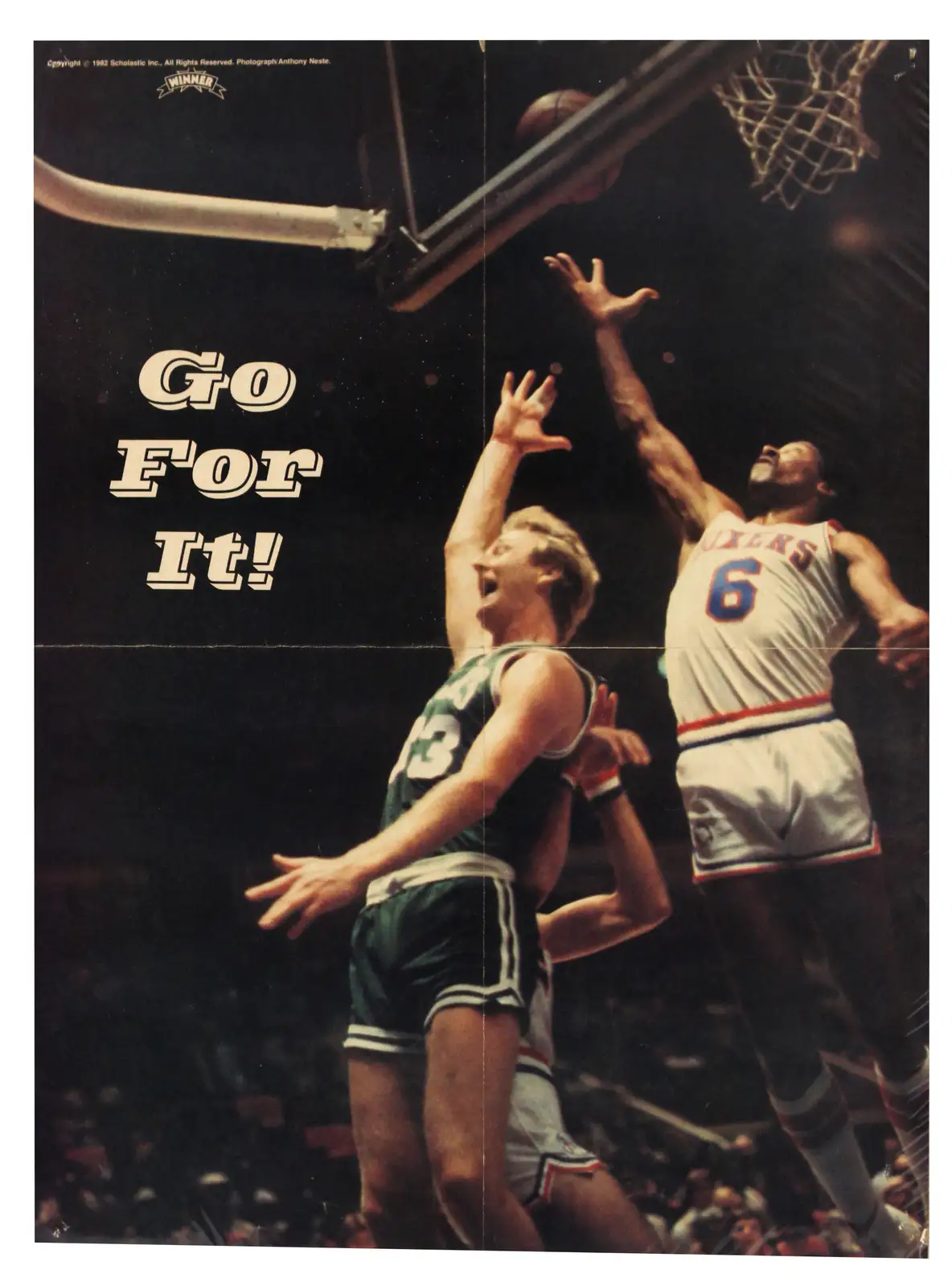 A vintage 1982 basketball poster shows two players mid-air near the hoop; one in a green jersey with number 13 appears to be…