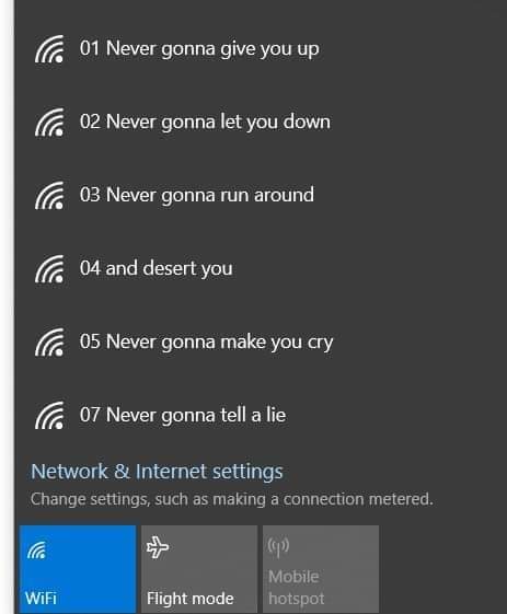 A screenshot of a Windows 10 settings menu showing WiFi options with the lyrics of 'Never Gonna Give You Up' humorously…