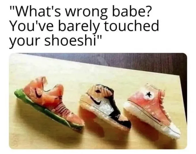 Three pieces of sushi shaped like sneakers are arranged on a wooden cutting board. Each piece mimics a different sneaker…
