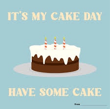 A simple graphic shows a cartoon chocolate cake with white frosting and three lit candles on a plate against a light blue…