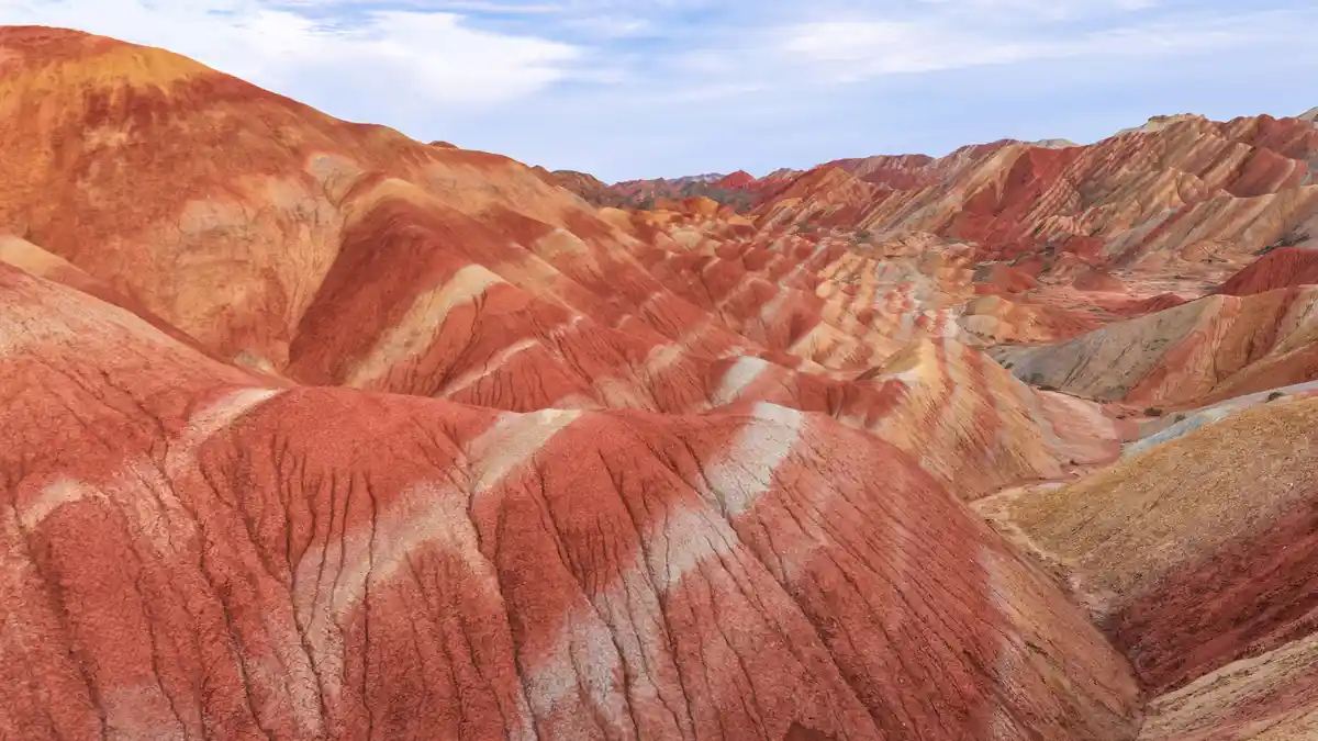 The Rainbow Mountains in Zhangye, China, showcase the stunning collision of beauty and chaos. 55 million years ago, the…