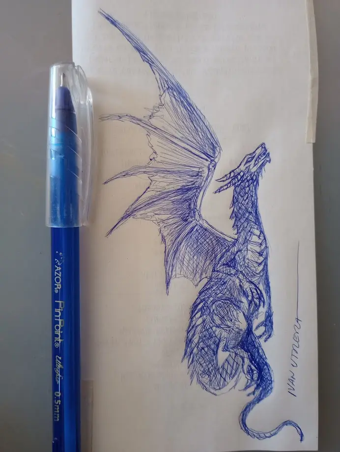 A blue ink sketch of a detailed dragon with spread wings and a long tail, drawn on white paper. Beside it stands a blue…
