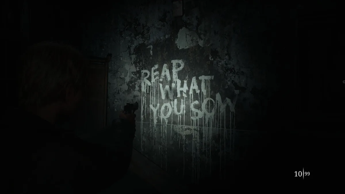 A character in a dark, gritty video game environment holds a handgun, pointing it at a wall with the phrase 'REAP WHAT YOU…