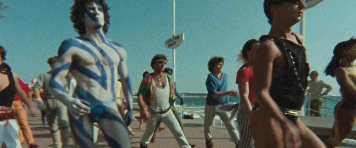 A collage of six beach scenes from the 1978 film 'The Blue Lagoon' featuring actors in swimwear and costumes, including a…