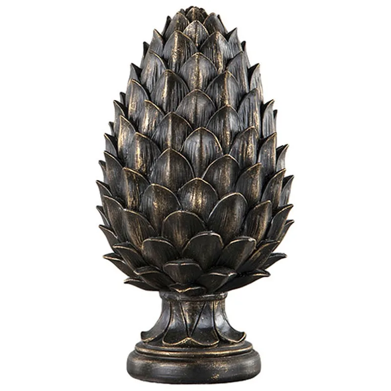 A decorative, bronze-colored pinecone sculpture stands on a pedestal against a plain white background. The overlaid text…