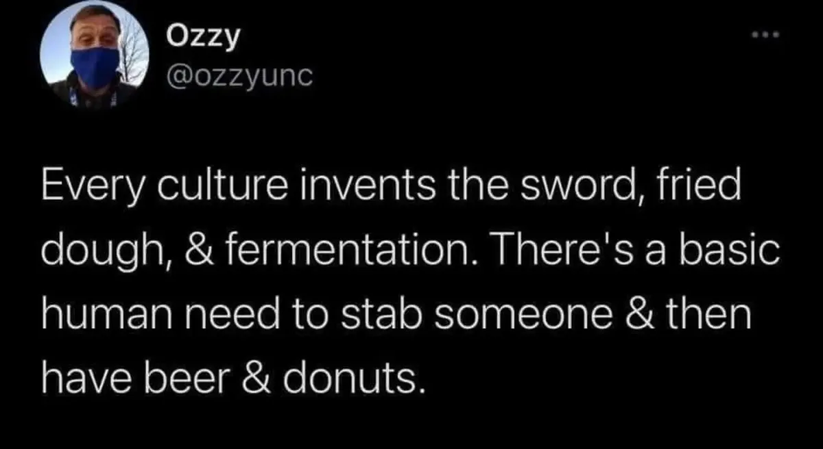 A screenshot of a tweet by user Ozzy (@ozzyunc) showing a man in a blue face mask. The tweet text humorously claims that…