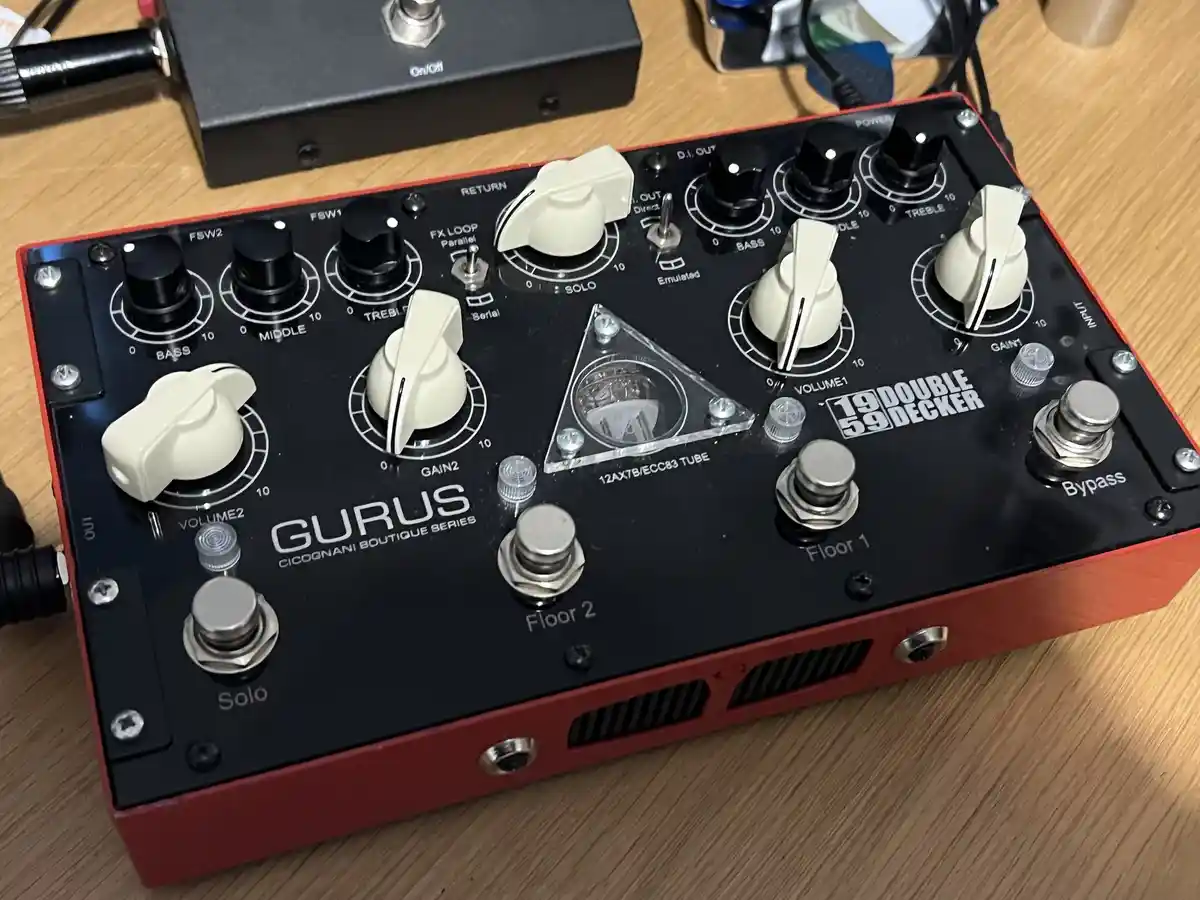 A close-up photo of a red and black guitar effects pedal labeled 'GURUS CICOGNANI BOUTIQUE SERIES' with '19 DOUBLE 59…