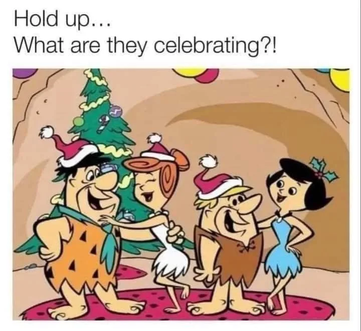 The Flintstones family—Fred, Wilma, Barney, and Betty—are shown dancing joyfully in their prehistoric cave, all wearing…