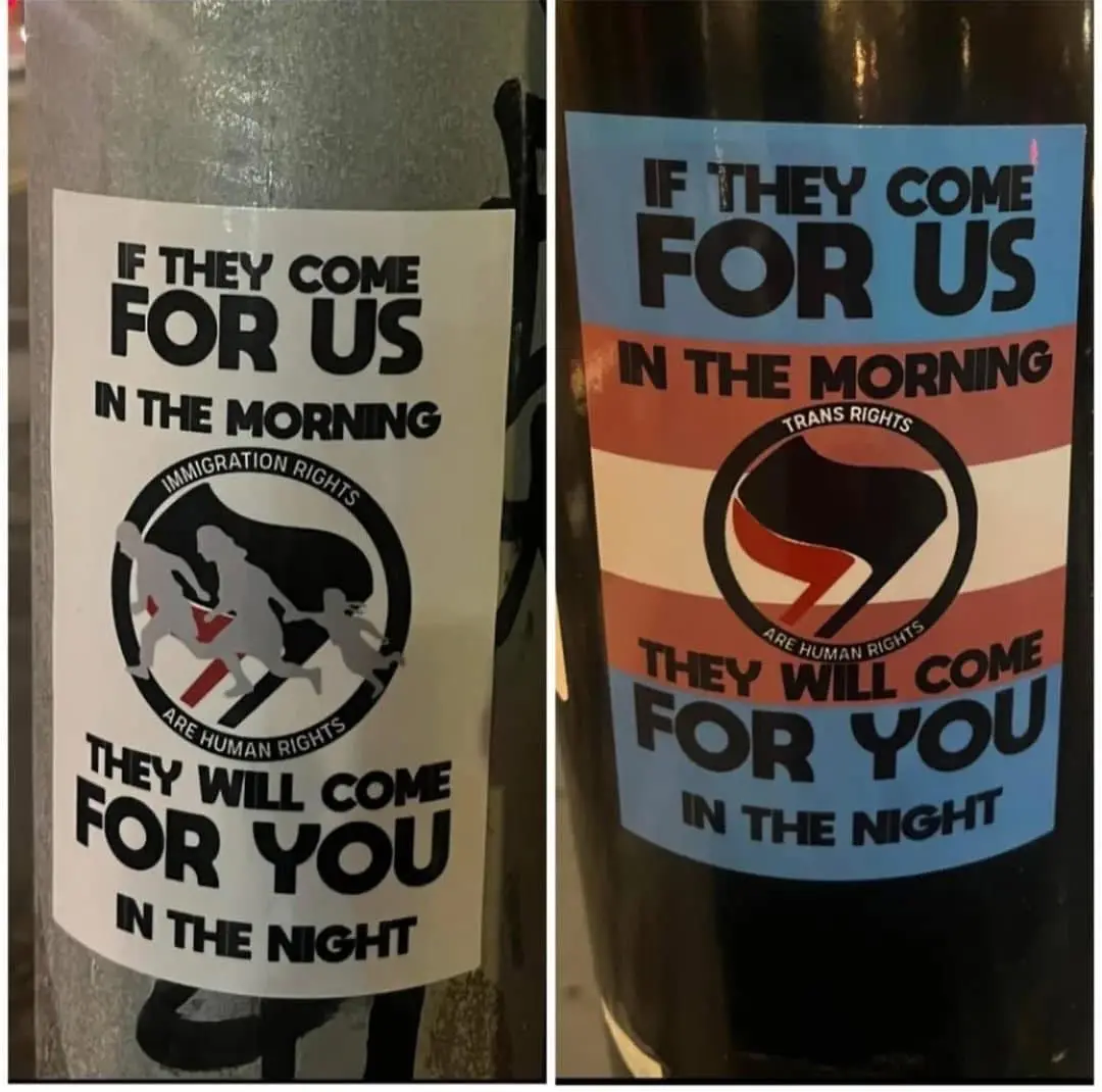 Two side-by-side stickers on bottles, one white with immigration rights imagery and the other with trans rights imagery…