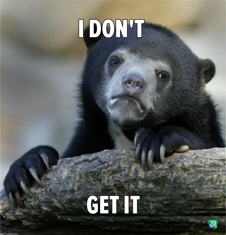 A close-up photo of a spectacled bear resting its paws on a log, looking confused and slightly annoyed. The bear has dark…