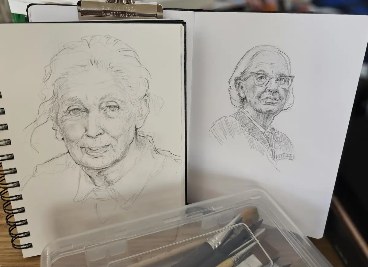 Two pencil sketches of an elderly woman are shown side-by-side in a sketchbook, one a rough initial sketch and the other a…