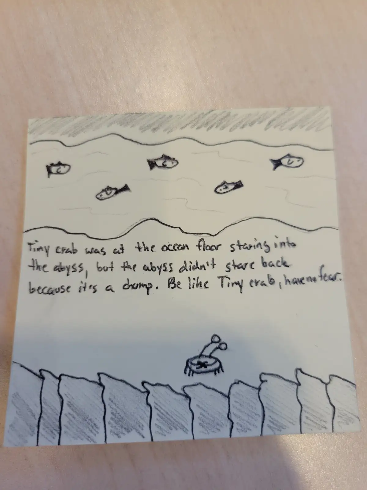 A hand-drawn sketch shows a tiny crab at the bottom of the ocean staring into a dark abyss, while fish swim above. The text…