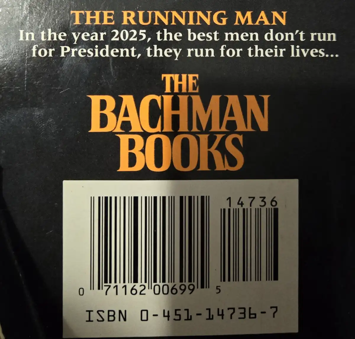 The image shows the back cover of a book titled 'THE RUNNING MAN' by 'THE BACHMAN BOOKS'. The cover has a black background…