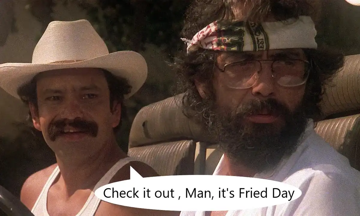 Two men are in a car; the man on the left wears a white cowboy hat and a white tank top, while the man on the right has a…