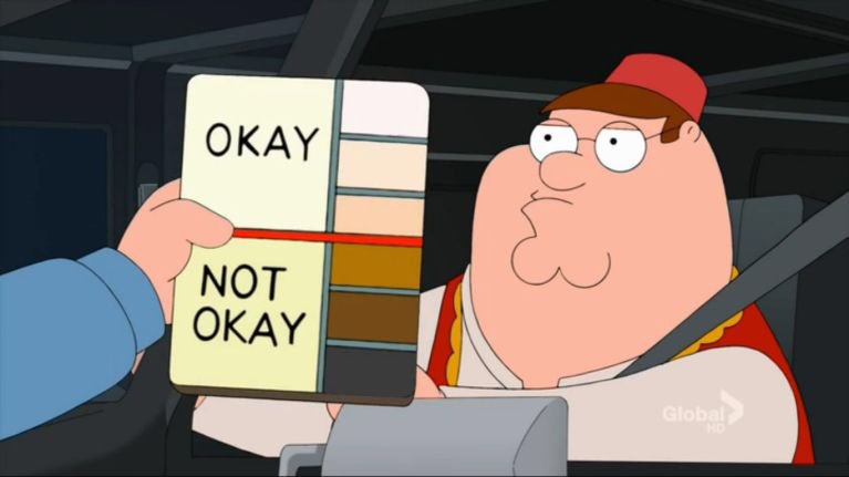 Peter Griffin from Family Guy sits in a car, looking confused as a hand holds up a color swatch card with 'OKAY' and 'NOT…