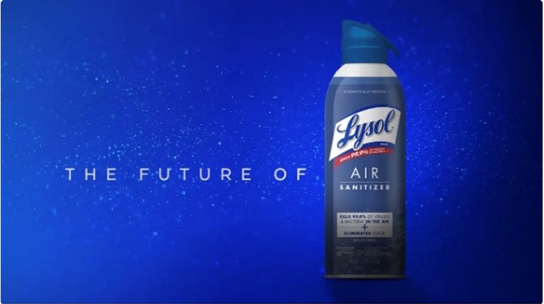 A Lysol Air Sanitizer spray bottle is centered against a deep blue, starry background. Large white text to the left reads…
