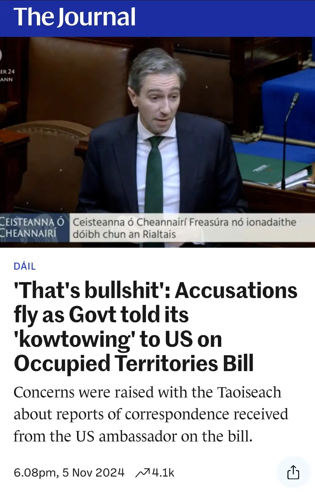 A screenshot of a news article from 'The Journal' featuring a man in a suit and tie speaking in what appears to be a…