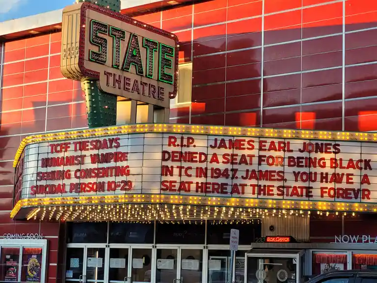 The image shows the marquee of the State Theatre, with a tribute message honoring James Earl Jones. The text on the marquee…