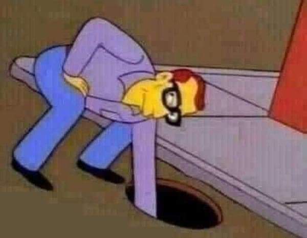a cartoon man in a purple suit and glasses is bent over, his head and upper torso stuck in a circular hole in the floor…