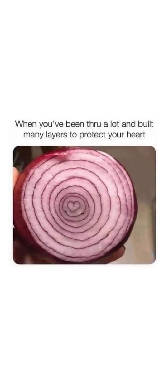 A close-up photo shows a sliced red onion revealing concentric rings, with a small heart shape visible at the very center…