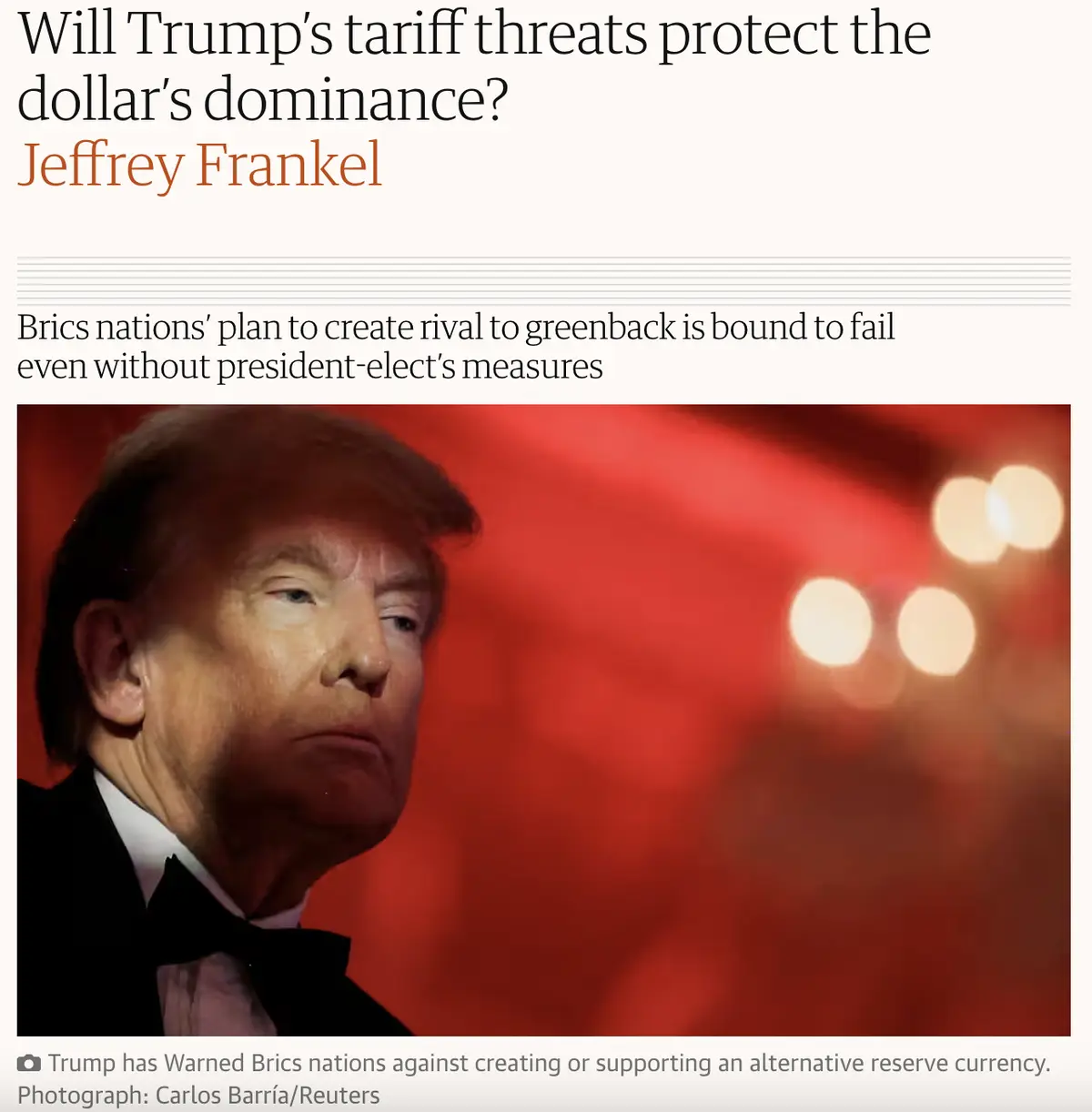 A close-up photo of Donald Trump in a tuxedo against a red background with blurred lights, overlaid with text from a news…