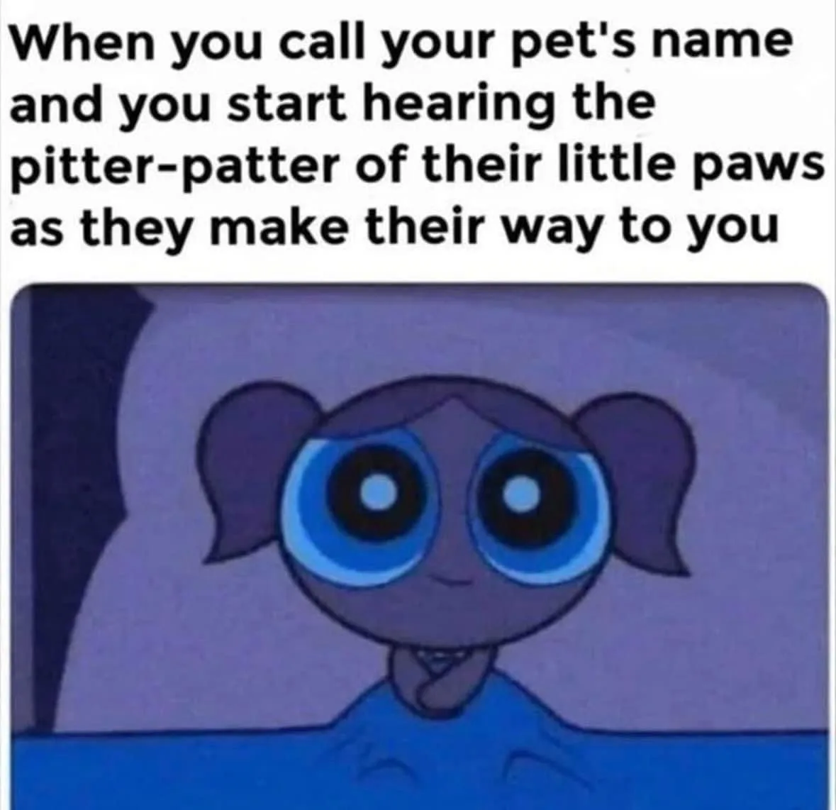 The image shows a cartoon character with large blue eyes and pigtails, looking forward with a gentle smile while lying in…