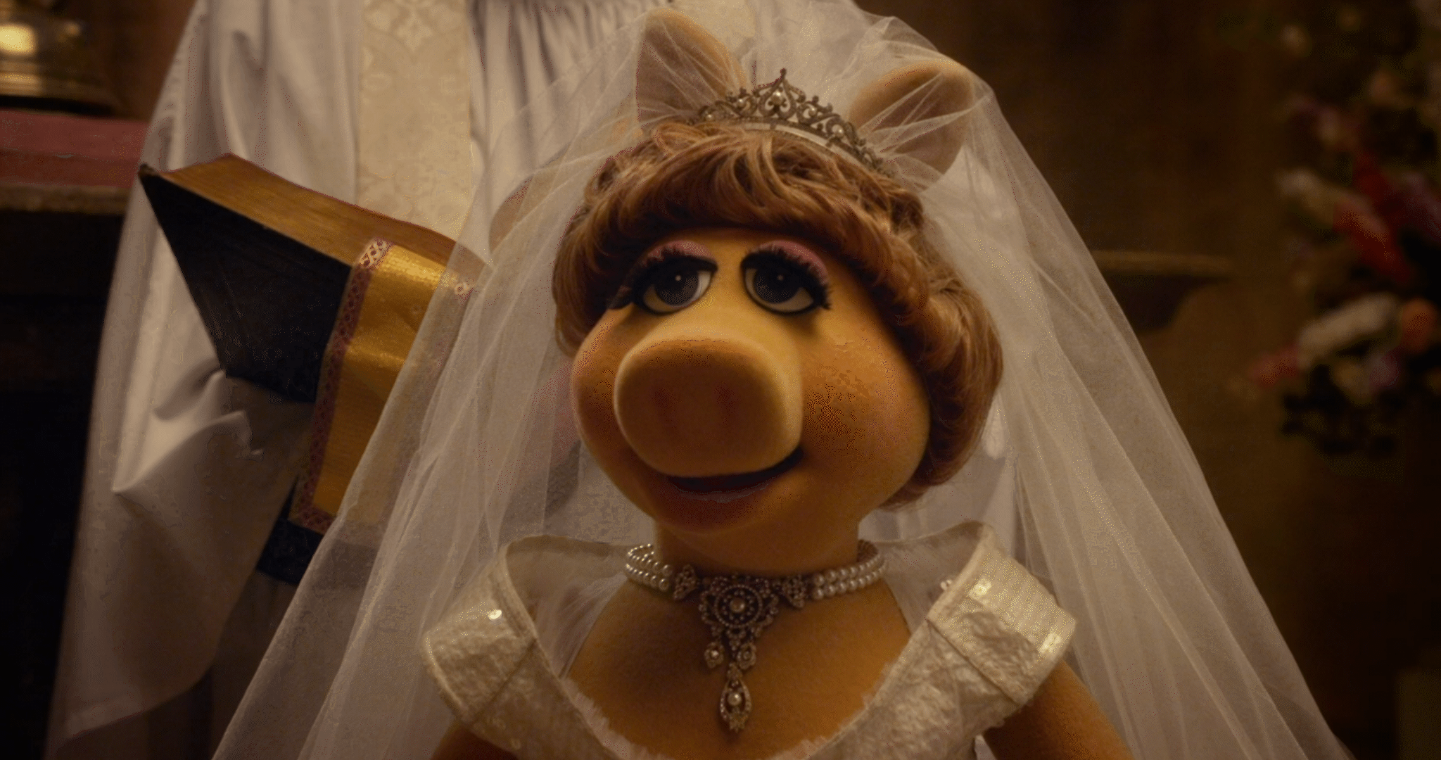 A sequence of six frames shows Miss Piggy in a wedding dress and veil, smiling and opening her mouth wider in each frame, as…